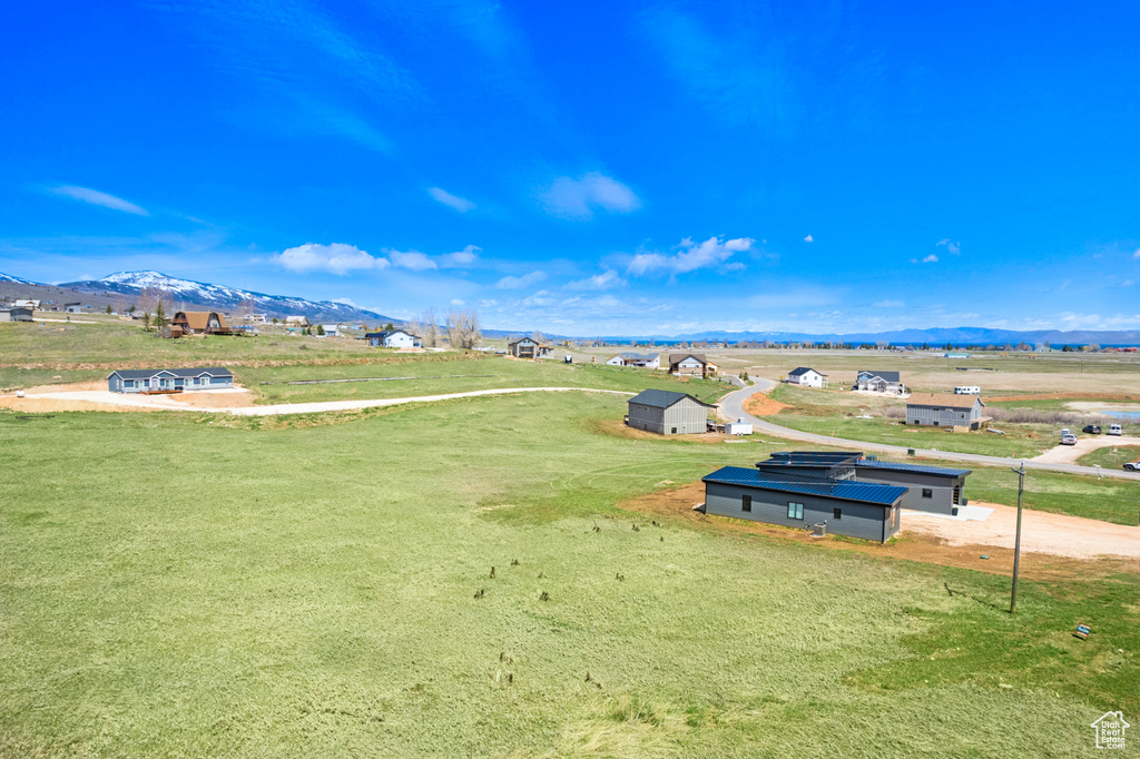 View of home's community featuring a mountain view and a rural view
