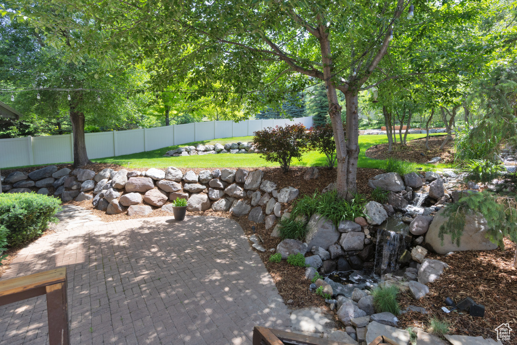Fenced backyard with a patio