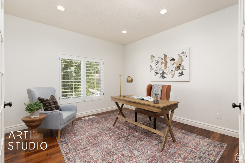 Office with wood finished floors, baseboards, and recessed lighting