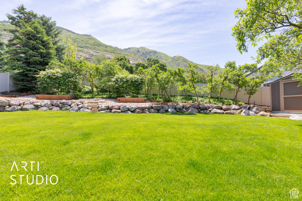 View of yard with a mountain view