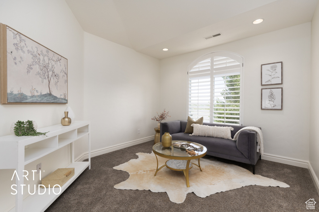 Carpeted living area featuring recessed lighting, baseboards, and lofted ceiling
