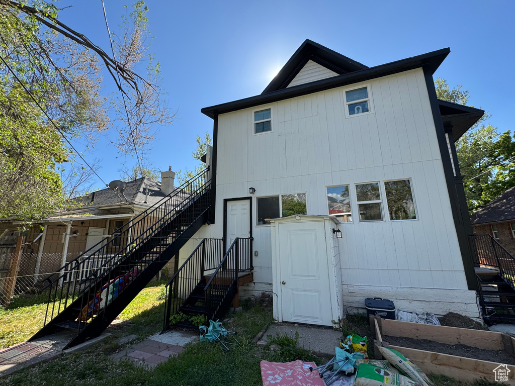 Back of property featuring stairway