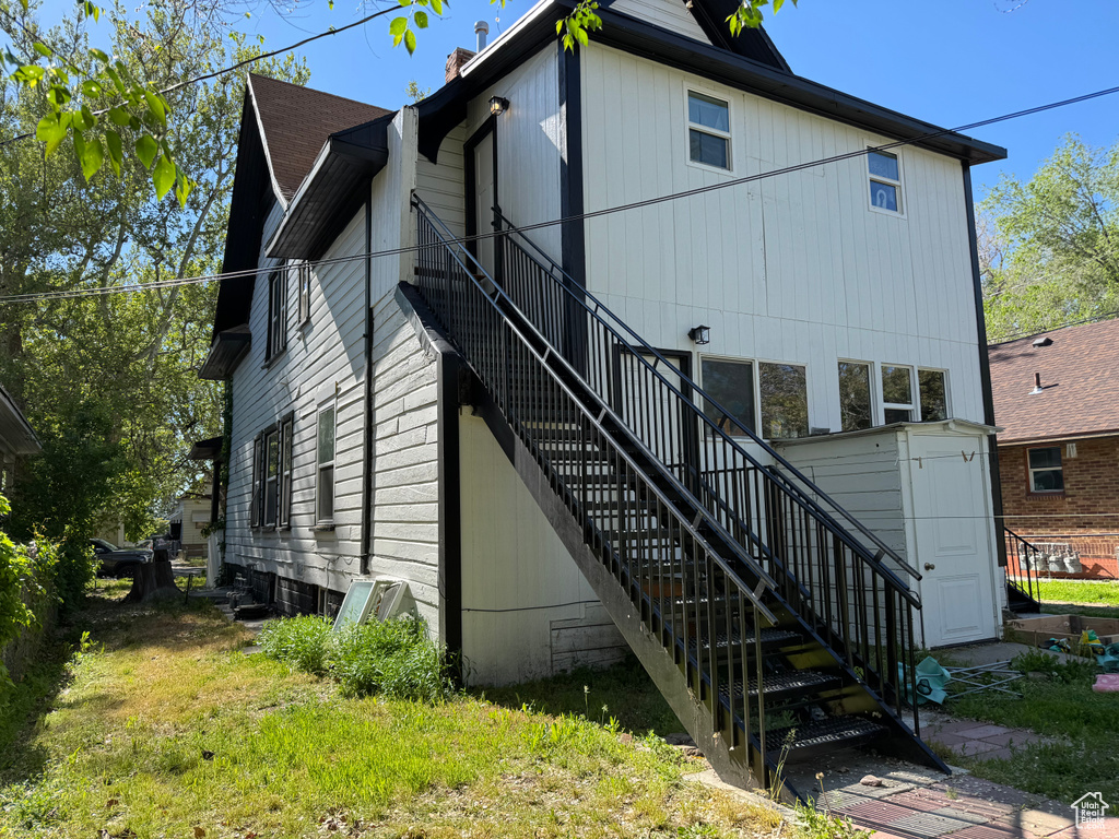 Back of house with stairs
