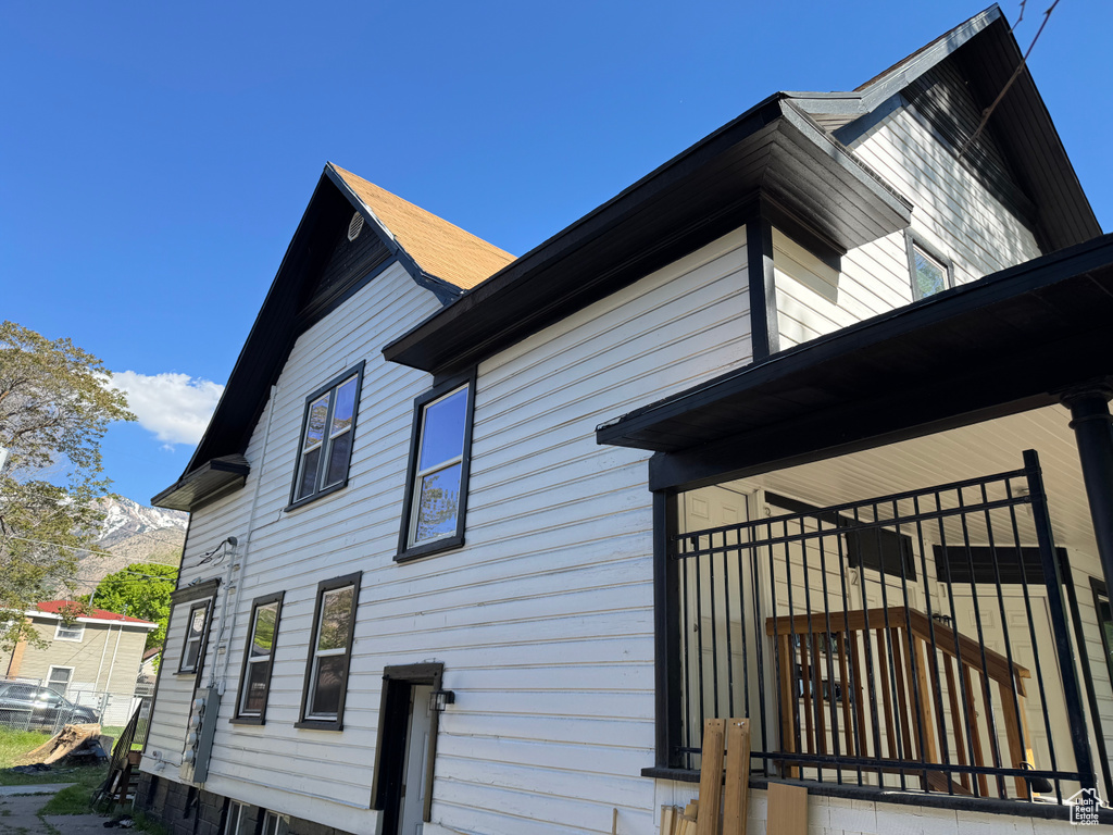 View of property exterior featuring a mountain view