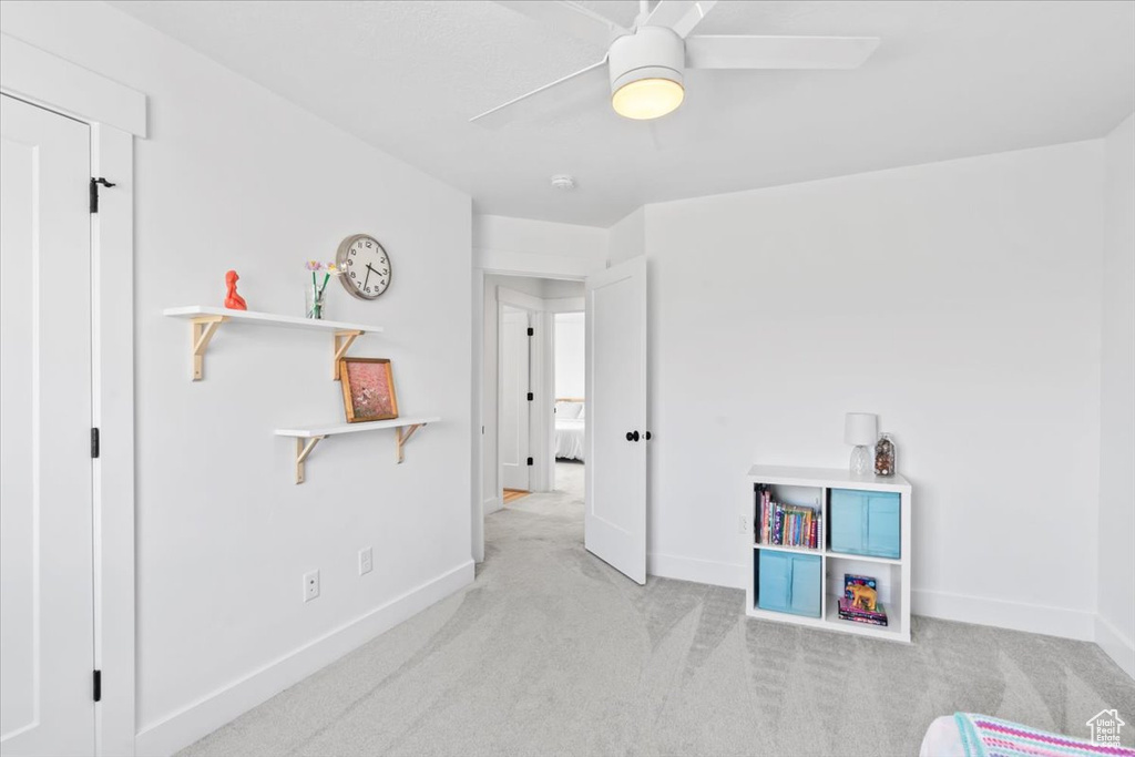 Game room with baseboards, carpet flooring, and ceiling fan