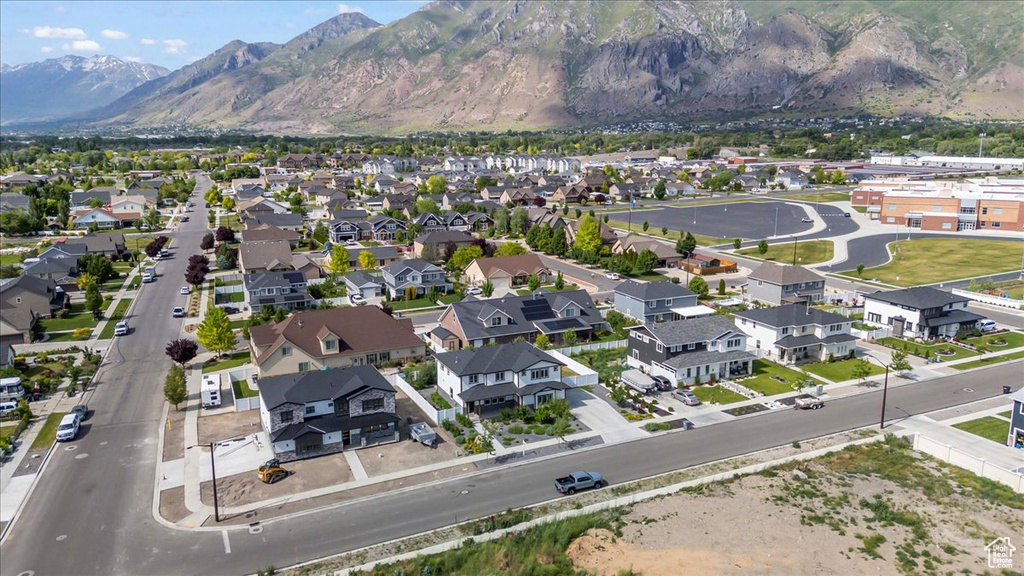Aerial view of property\\\\\\\'s location with a mountainous background and nearby suburban area