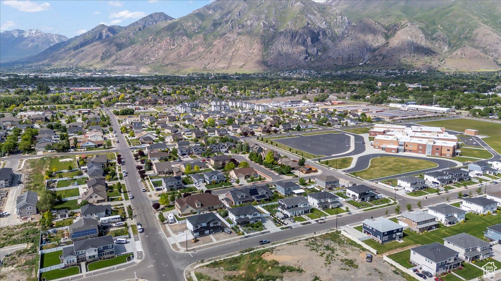 View of property location featuring mountains and nearby suburban area
