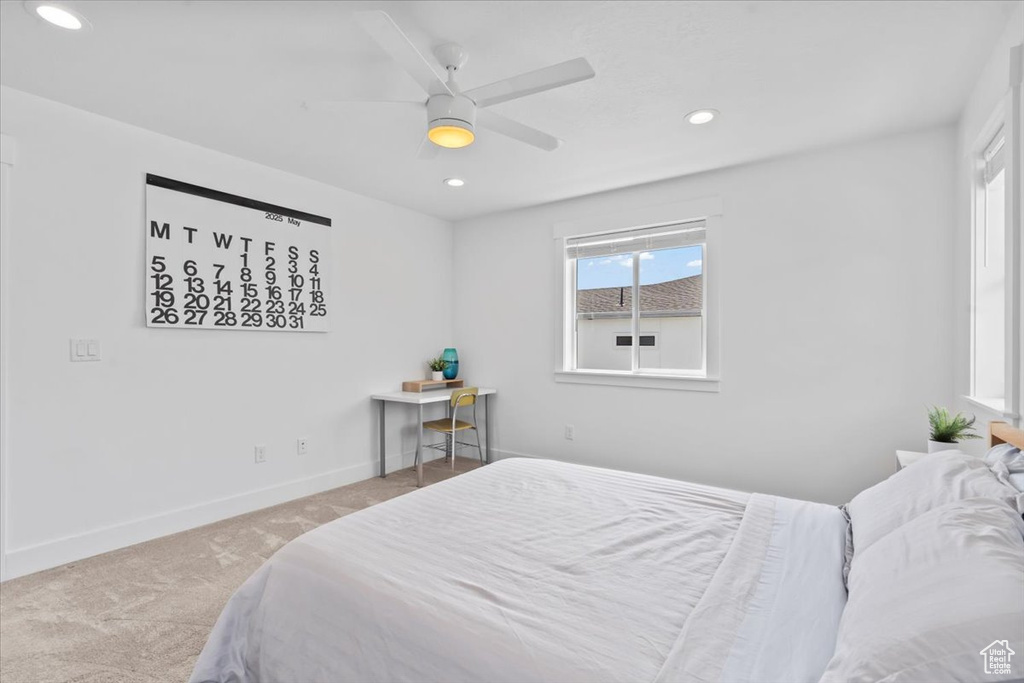 Carpeted bedroom with recessed lighting, baseboards, and ceiling fan