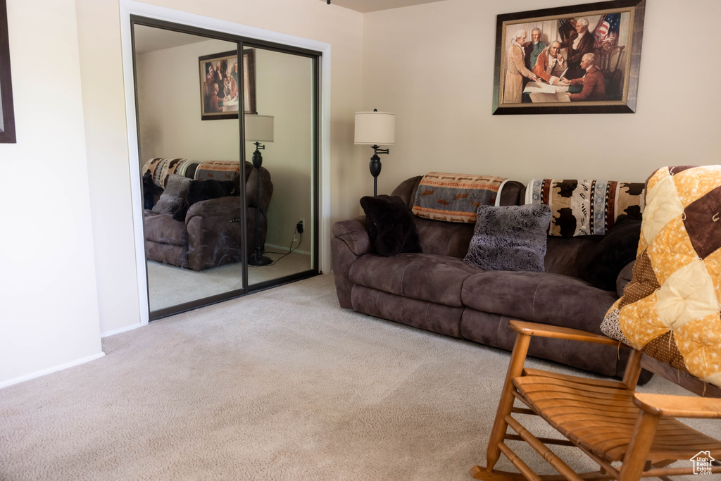 Carpeted living room with baseboards