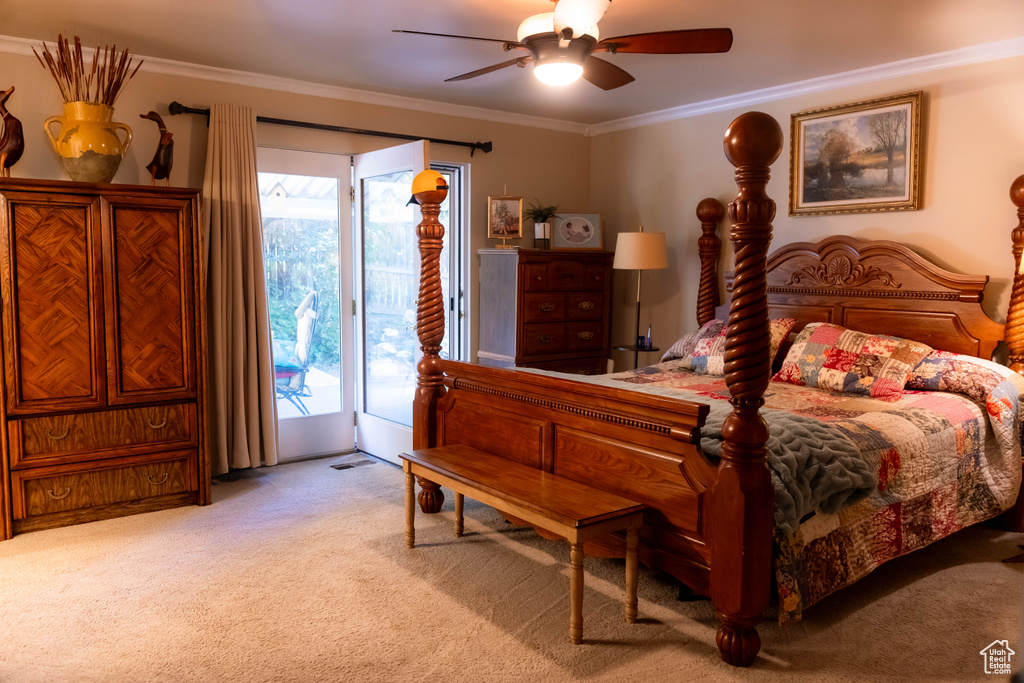 Bedroom with access to exterior, light colored carpet, crown molding, and a ceiling fan
