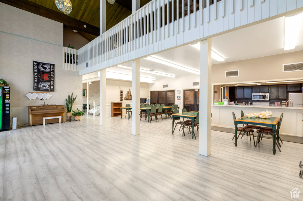 Living room with a towering ceiling and wood finished floors