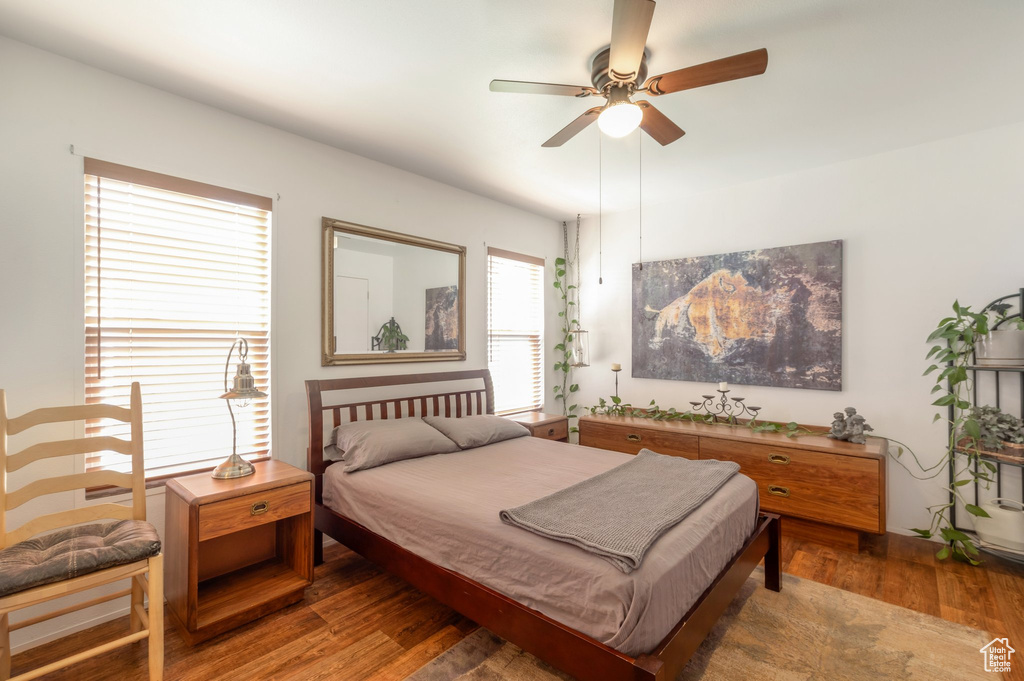 Bedroom with wood finished floors and ceiling fan