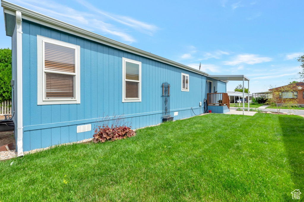 View of home\\\'s exterior featuring a lawn