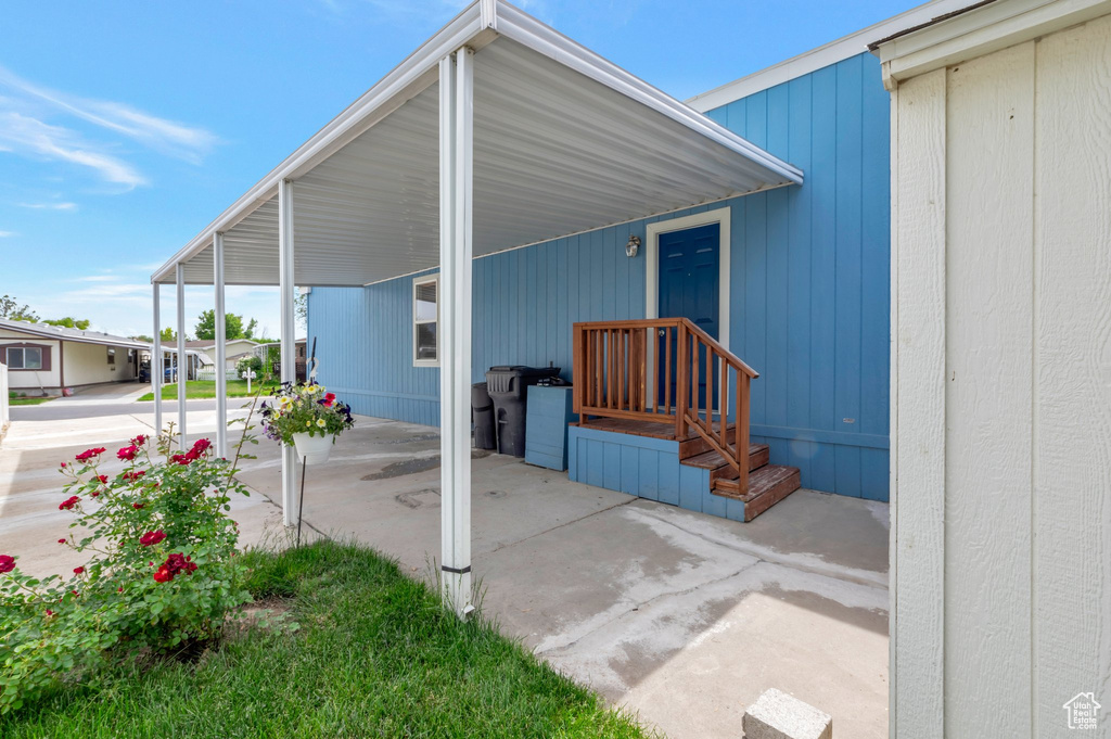 View of patio with an attached carport