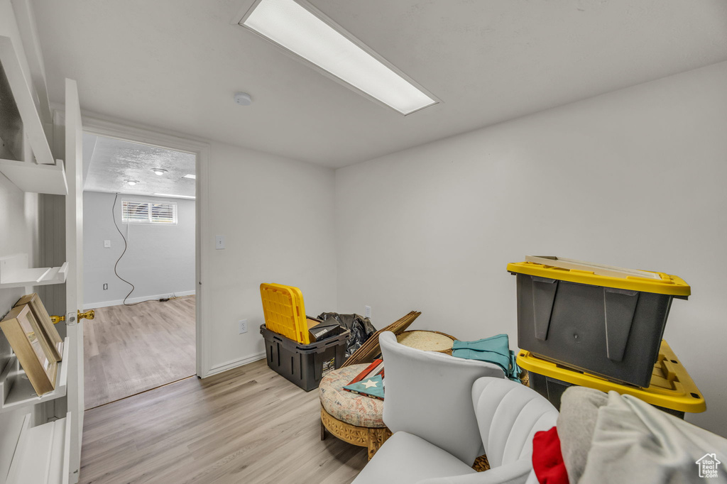 Living area featuring wood finished floors and baseboards