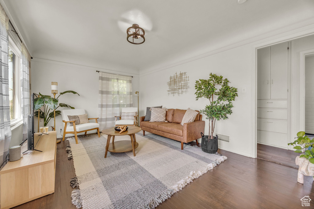 Living room featuring wood finished floors and baseboards