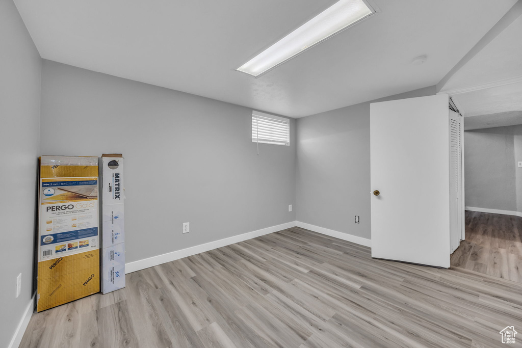 Below grade area with wood finished floors and baseboards