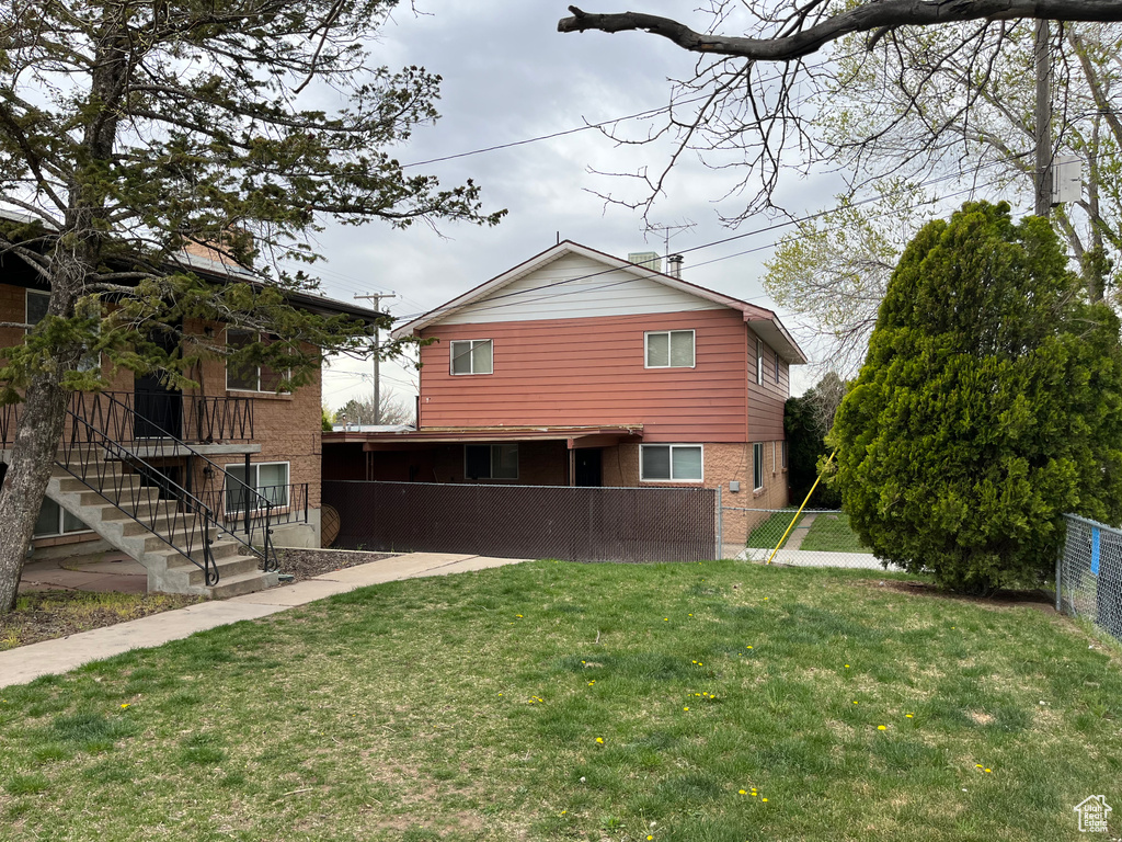 Back of property featuring brick siding