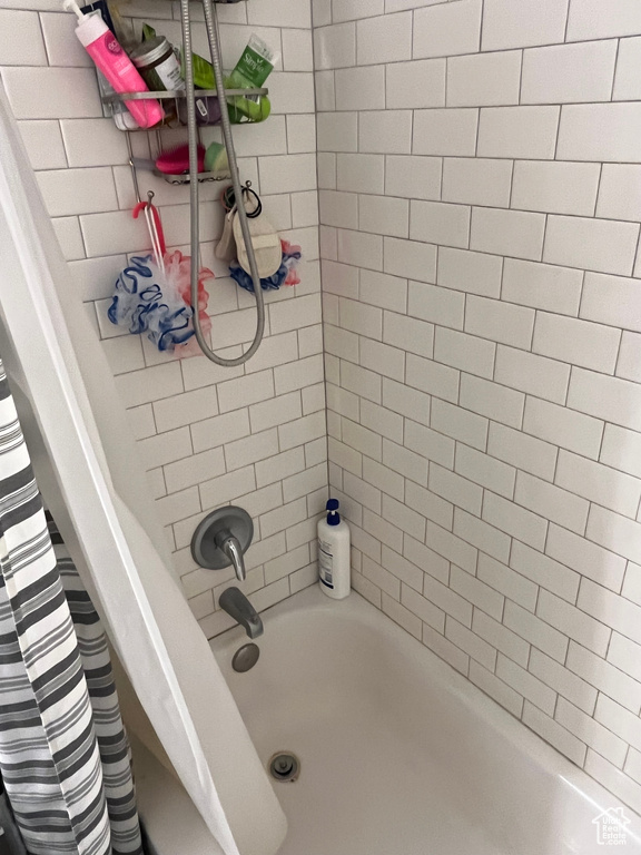 Full bath featuring shower / bathtub combination with curtain