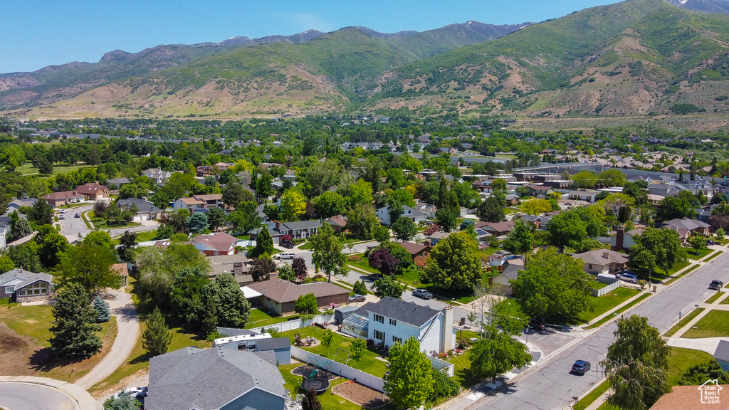 Aerial perspective of suburban area with a mountainous background
