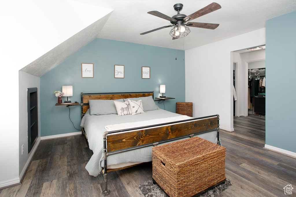 Bedroom with wood finished floors, baseboards, and ceiling fan