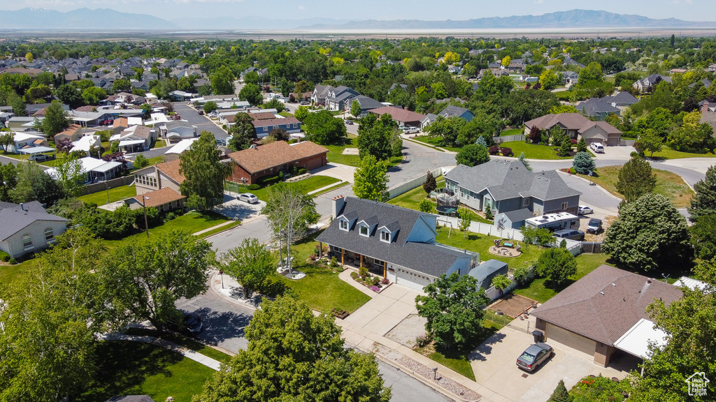 Aerial view of residential area featuring mountains