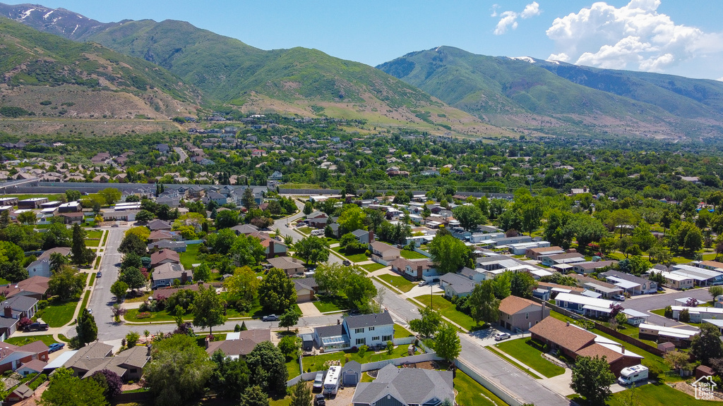 Aerial perspective of suburban area with a mountainous background