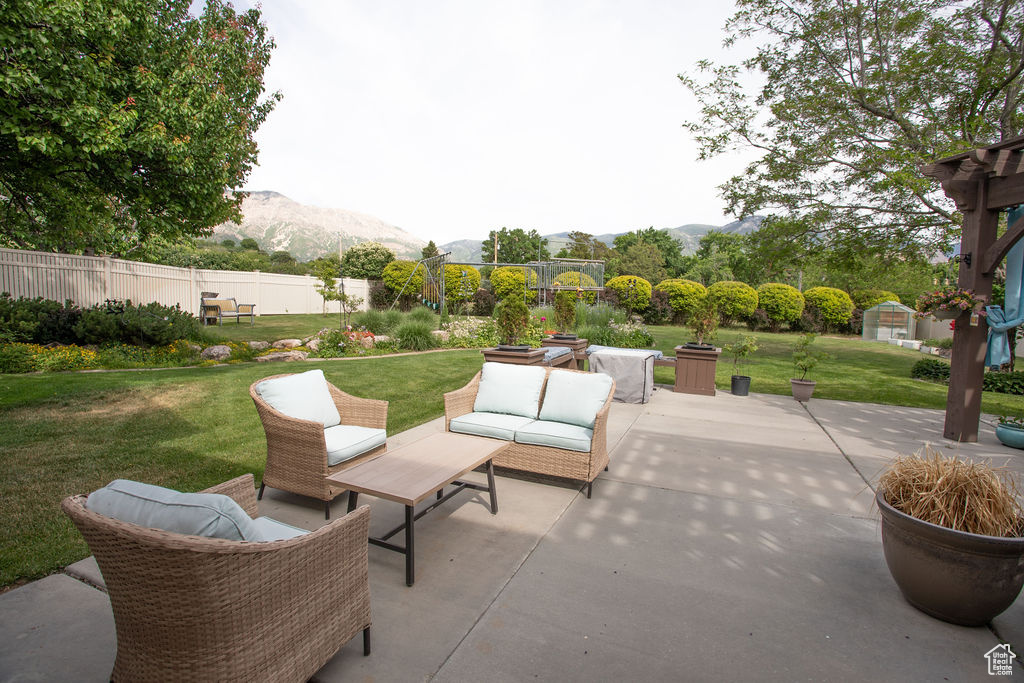 View of patio / terrace featuring a mountain view and outdoor lounge area