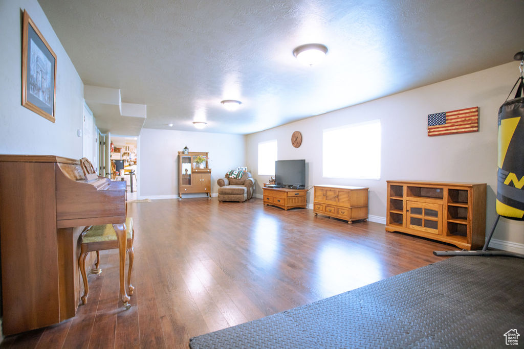 Sitting room featuring wood finished floors and baseboards