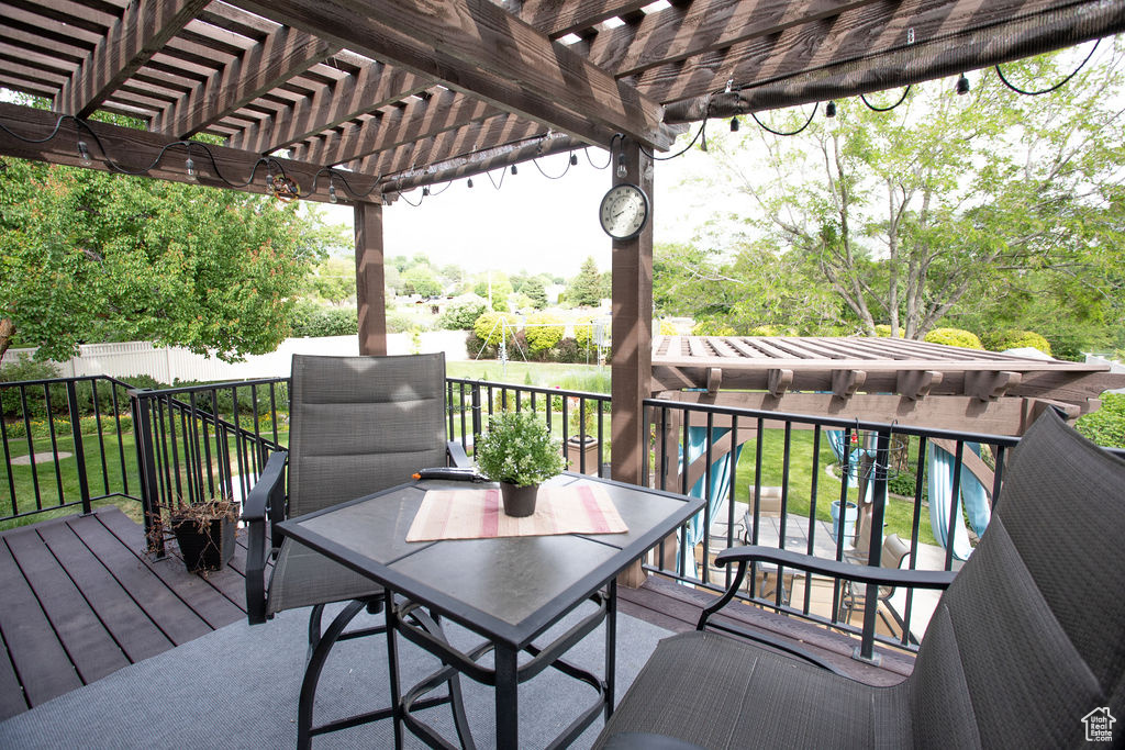Wooden deck featuring a pergola