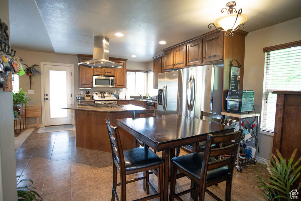 Dining room featuring tile patterned floors, recessed lighting, and baseboards