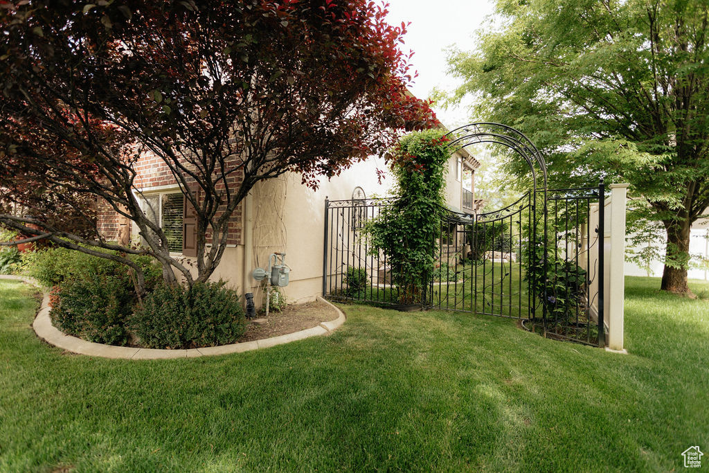 View of yard featuring a gate