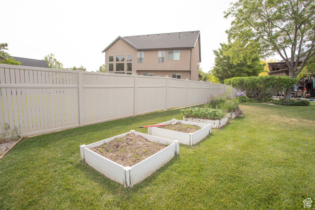 View of yard featuring a garden