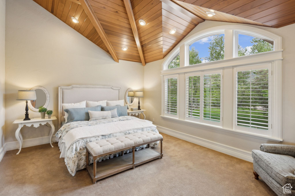 Bedroom with vaulted ceiling, carpet, wood ceiling, and baseboards