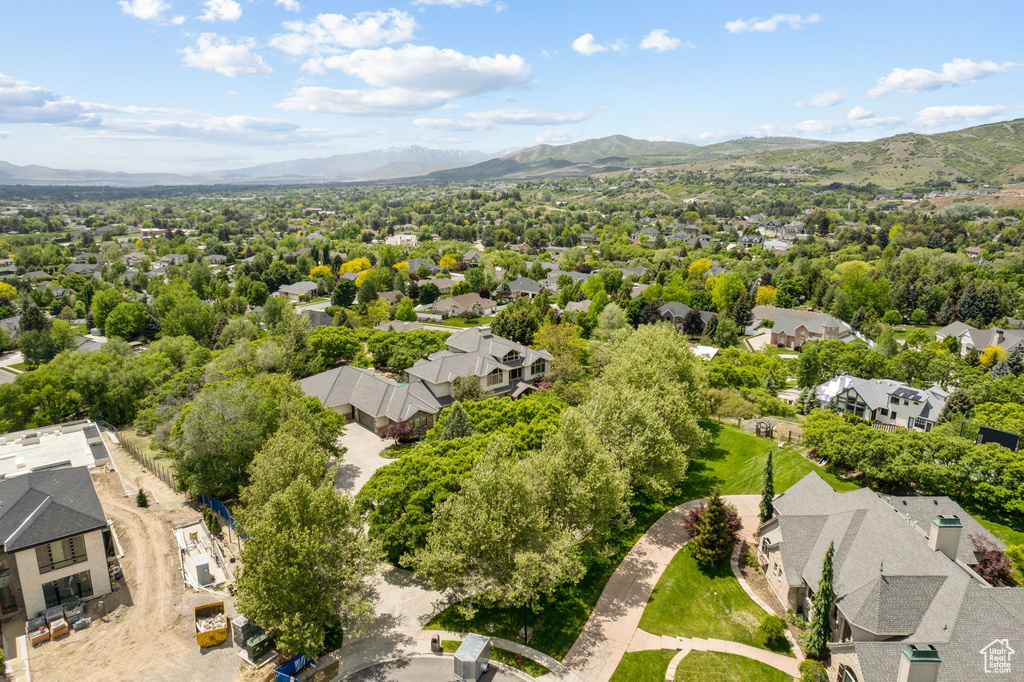 Aerial view of residential area with a mountainous background