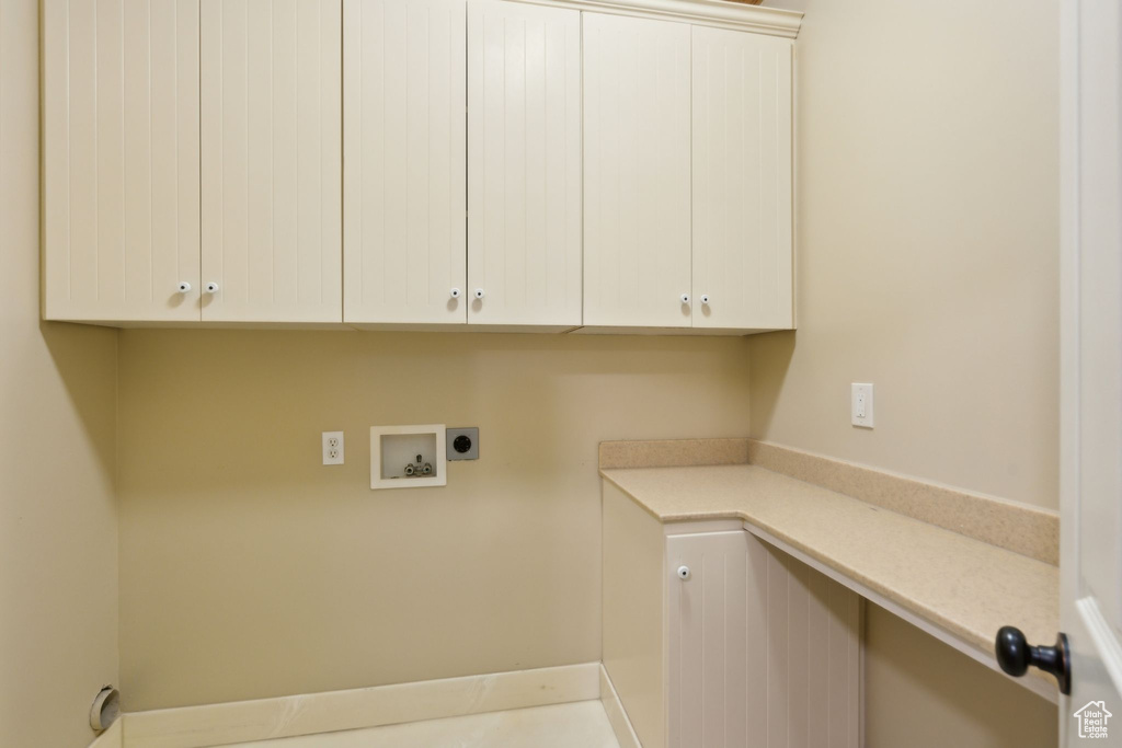 Laundry room with cabinet space, washer hookup, and electric dryer hookup