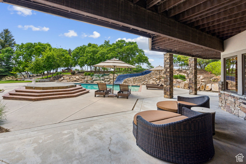 View of patio / terrace with an outdoor pool