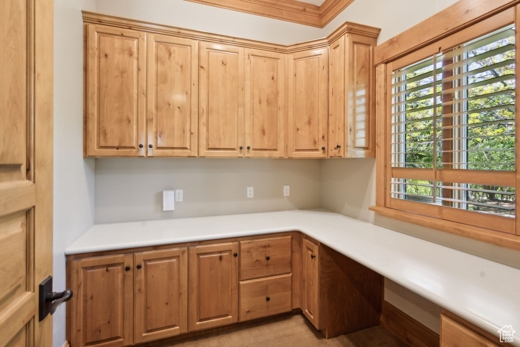 Kitchen featuring plenty of natural light and light countertops