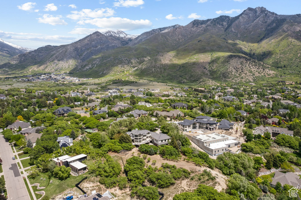 Aerial perspective of suburban area featuring a mountain backdrop