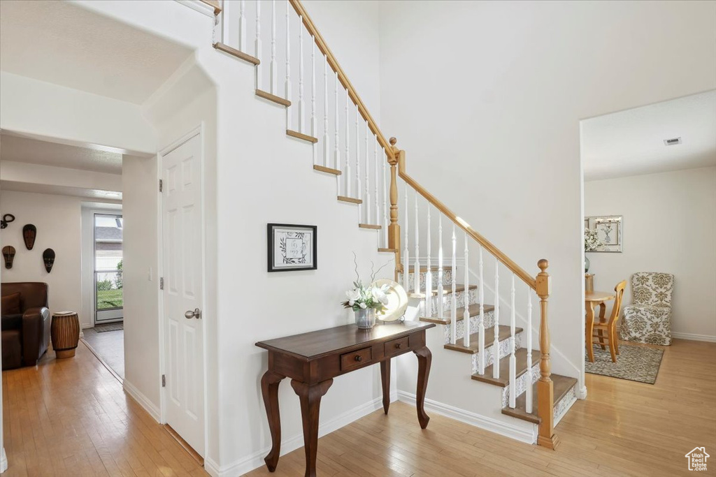 Stairs featuring wood-type flooring and baseboards