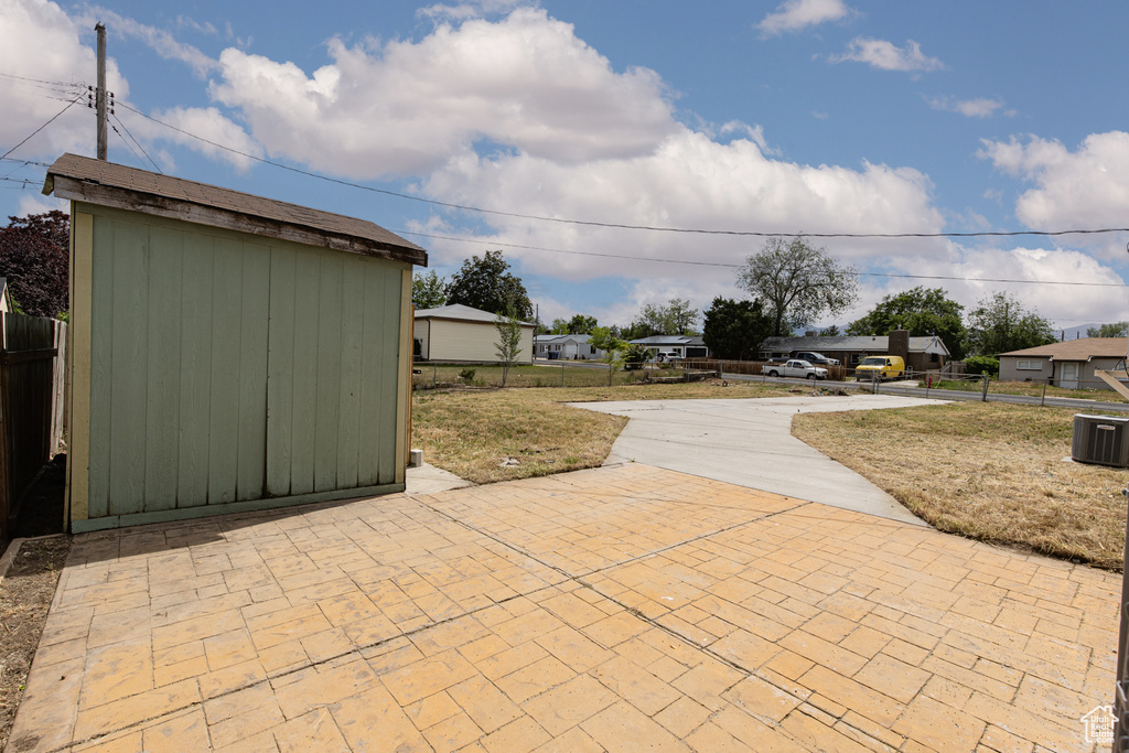 View of patio / terrace featuring driveway and central air condition unit