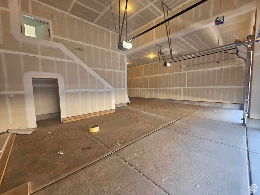 Garage featuring a garage door opener