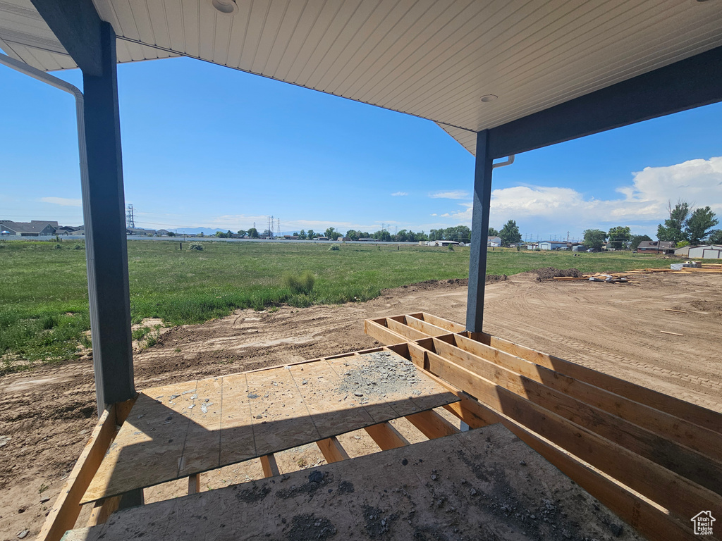 View of yard with a rural view