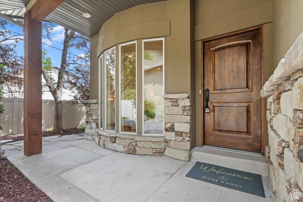 View of exterior entry with stone siding