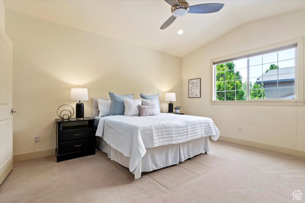 Bedroom with vaulted ceiling, light colored carpet, baseboards, a ceiling fan, and recessed lighting