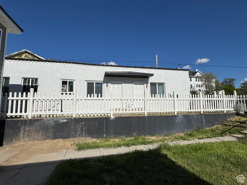 Back of house featuring a fenced front yard