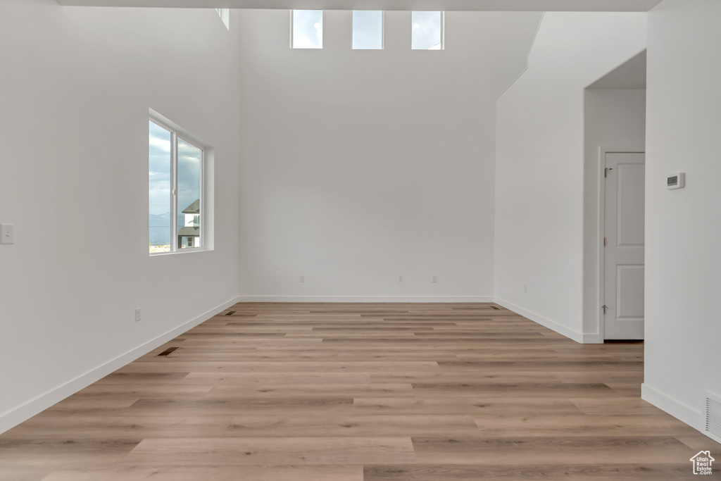 Spare room with light wood finished floors and baseboards