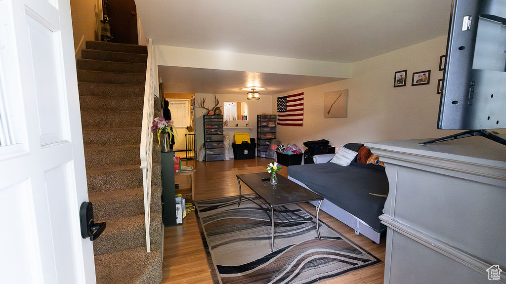 Living area featuring wood finished floors and stairway