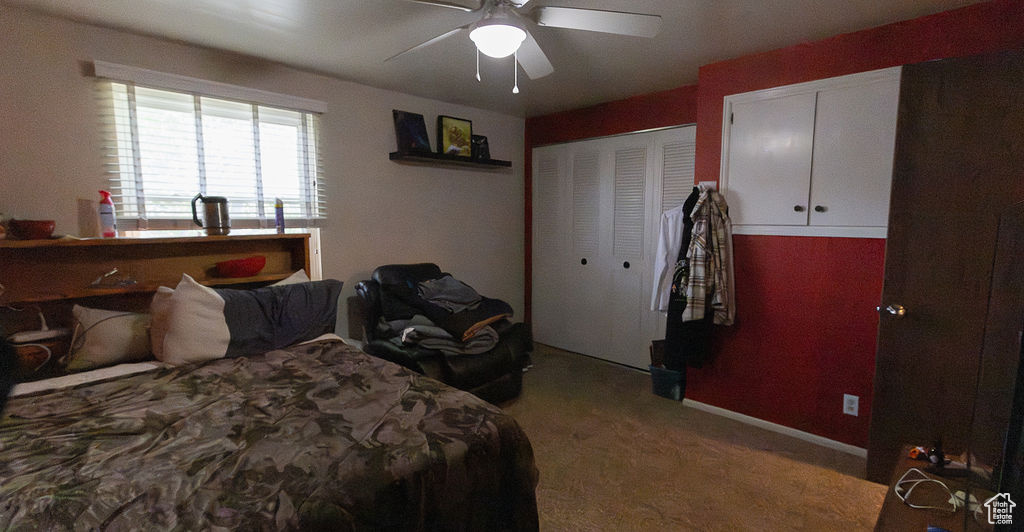 Bedroom with carpet and ceiling fan