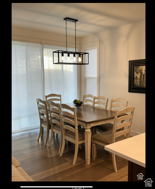 Dining area featuring wood finished floors